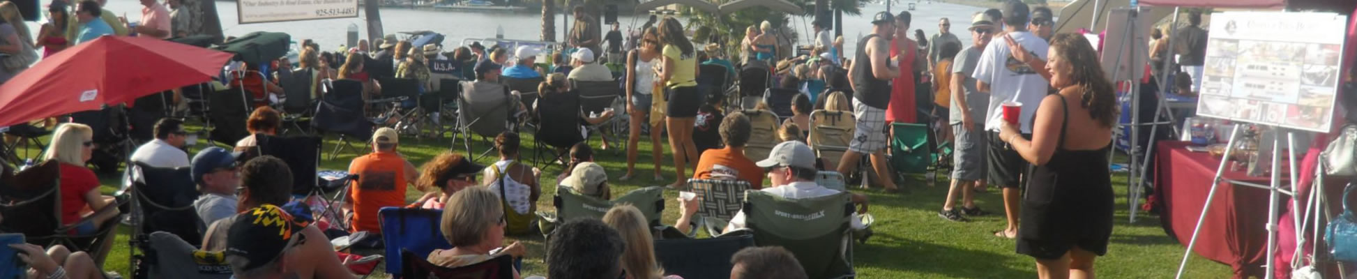 Discovery Bay neighbors gathering for a waterfront community concert